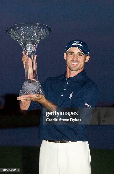 Golfer Jonathan Byrd poses with the trophy after he hit a hole-in-one to win the tournament at the Justin Timberlake Shriners Hospitals for Children...