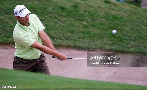 Cameron Percy hits out of a sand trap on the 17th hole of on the second hole of a playoff during the final round of the Justin Timberlake Shriners...