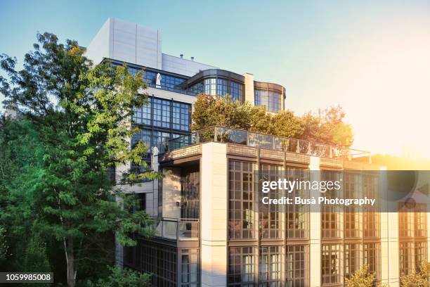rooftop terrace on top of modern luxury townhouse as seen from the highline park on an elevated railway road in the meatpacking district, manhattan, new york city - rooftop deck stock pictures, royalty-free photos & images