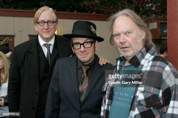 Musician/producer T-Bone Burnett, musicians Elvis Costello and Neil Young pose backstage during the 24th annual Bridge School Benefit at the...