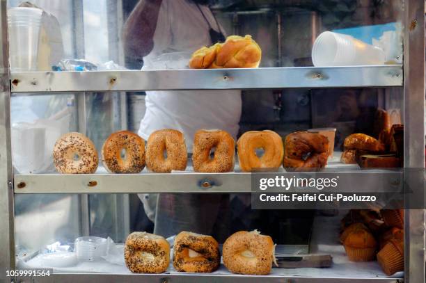 street vendor for donuts at new york, usa - bagel stock-fotos und bilder