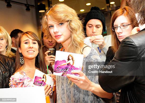 Singer Taylor Swift purchases her new album "Speak Now" at the Times Square Starbucks on October 25, 2010 in New York City. The album is on sale at...