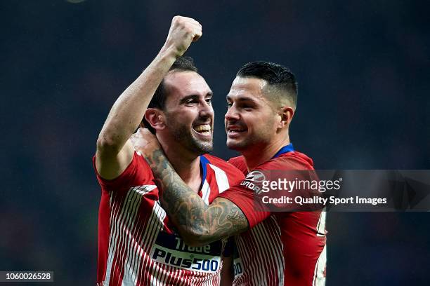 Diego Godin of Atletico de Madrid celebrates after scoring his team's third goal with Vitolo Machin during the La Liga match between Club Atletico de...