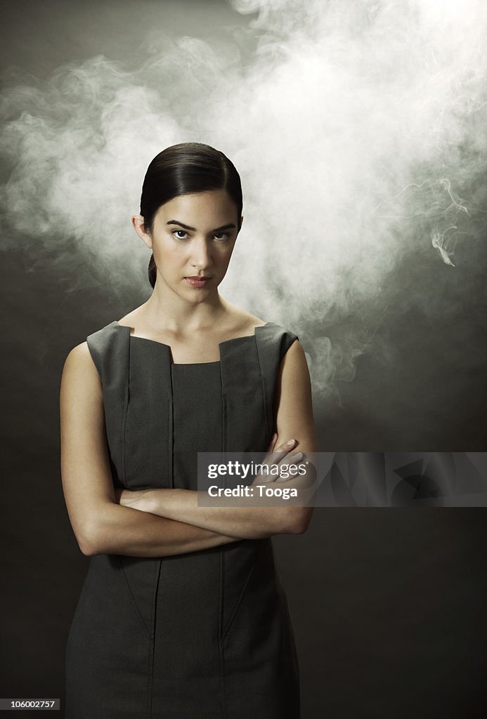 Frustrated businesswoman fuming with smoke