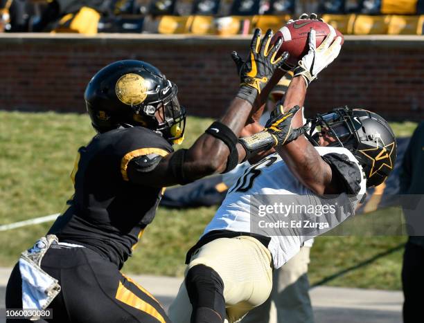 Kalija Lipscomb of the Vanderbilt Commodore catches a touchdown pass against defensive back DeMarkus Acy of the Missouri Tigers in the third quarter...