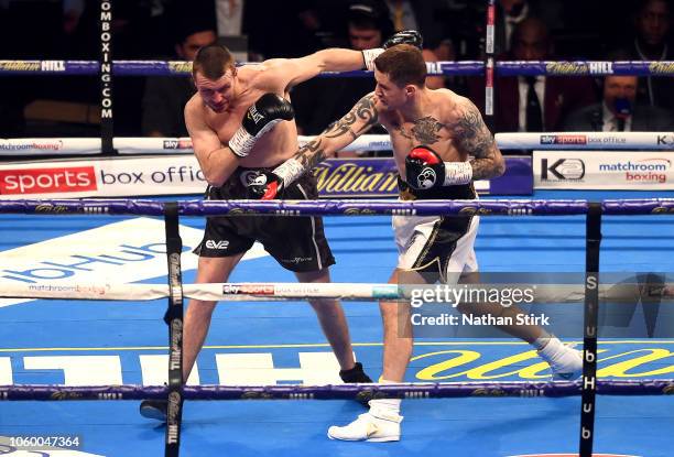 Ricky Burns of England punches Scott Cardle of England during the Lightweight Contest between Ricky Burns and Scott Cardle at Manchester Arena on...