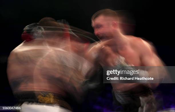 Scott Cardle of England punches Ricky Burns of England during the Lightweight Contest between Ricky Burns and Scott Cardle at Manchester Arena on...