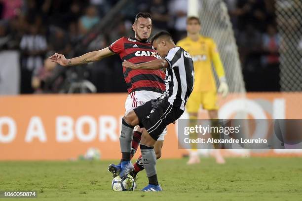 Erik of Botafogo struggles for the ball with Rever of Flamengo during the match between Botafogo and Flamengo as part of Brasileirao Series A 2018 at...