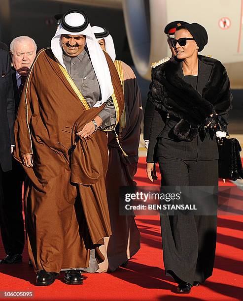 The Emir of Qatar, Sheikh Hamad bin Khalifa al Thani , and his wife Sheikha Mozah arrive at London's Heathrow airport, on October 25 for the start of...