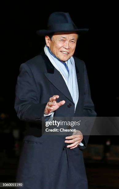 Japan's Deputy Prime Minister Taro Aso arrives to attend a dinner hosted by French President Emmanuel Macron at the Orsay museum on November 10, 2018...