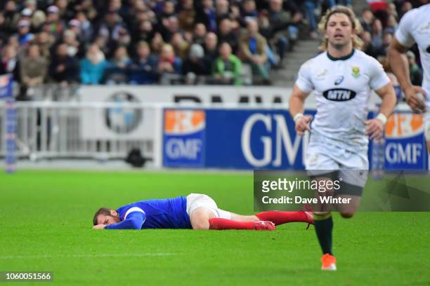 Camille Lopez of France goes down injured after an unpunished late tackle by Faf de Klerk of South Africa during the Test match between France and...