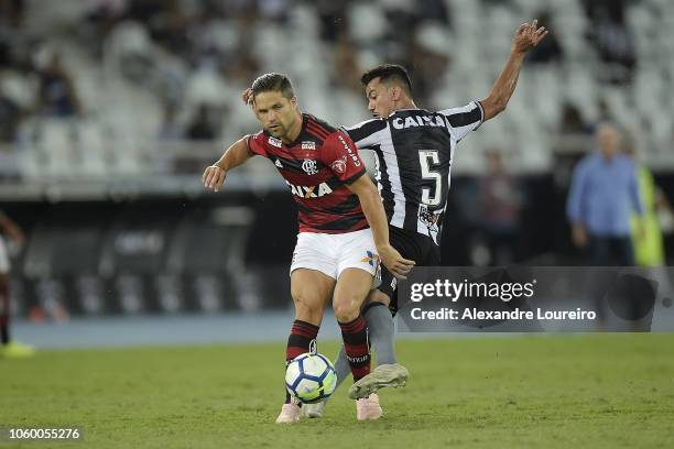 Rodrigo Lindoso of Botafogo struggles for the ball with Diego of Flamengo during the match between Botafogo and Flamengo as part of Brasileirao...