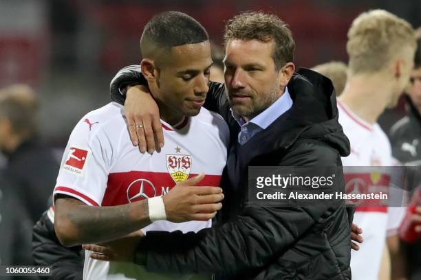Markus Weinzierl head coach of Stuttgart celebrates victory with his player Dennis Aogo after winning the Bundesliga match between 1. FC Nuernberg...