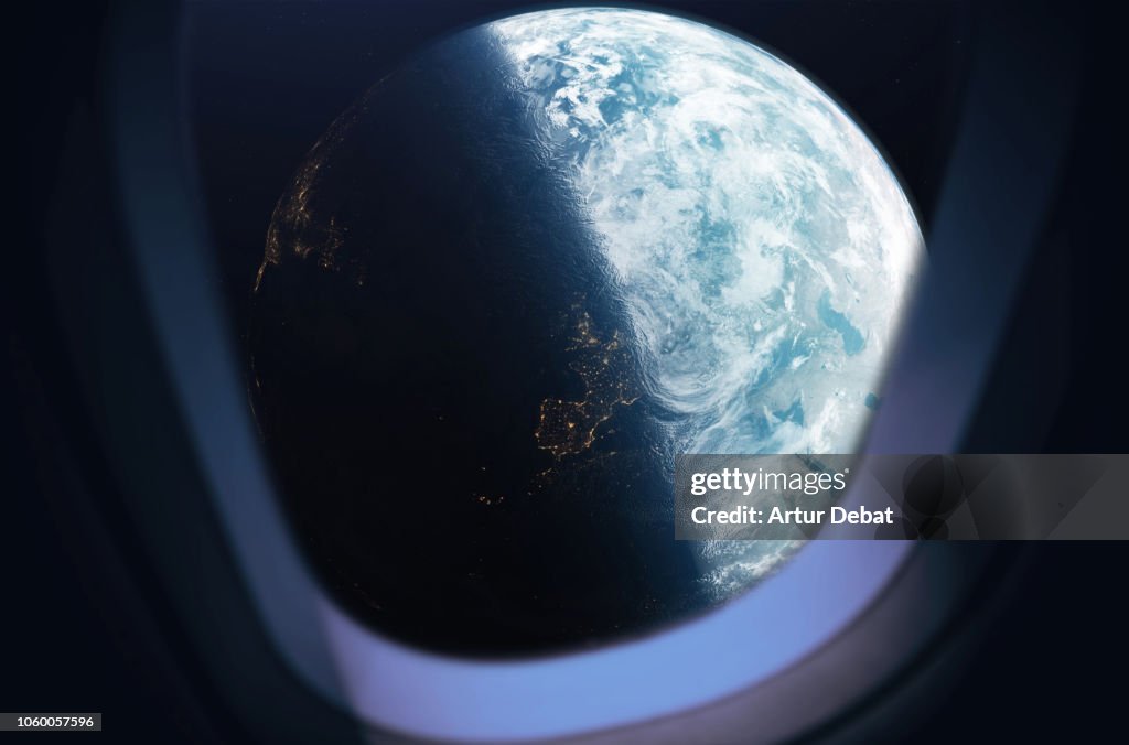 The planet earth taken from the spaceship window during outer space trip.