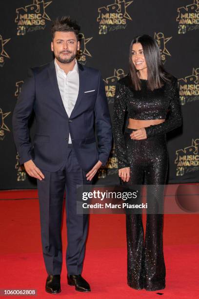 Actor Kev Adams and singer Jenifer Bartoli attend the 20th NRJ Music Awards at Palais des Festivals on November 10, 2018 in Cannes, France.