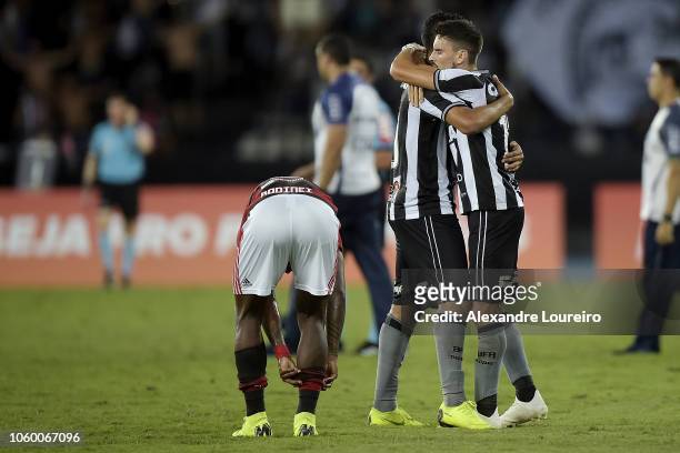 Rodrigo Pimpão and Matheus Fernandes celebrete the victory after the match between Botafogo and Flamengo as part of Brasileirao Series A 2018 at...