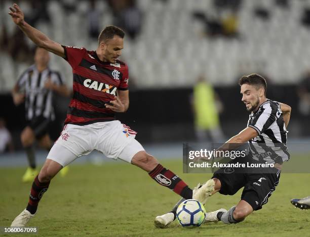 Rodrigo Pimpão of Botafogo struggles for the ball with Rene of Flamengo during the match between Botafogo and Flamengo as part of Brasileirao Series...