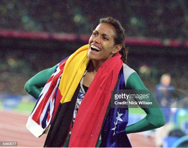 Cathy Freeman of Australia is elated after winning Gold in the 400m Final during the 2000 Sydney Olympic Games at Stadium Australia in Sydney,...