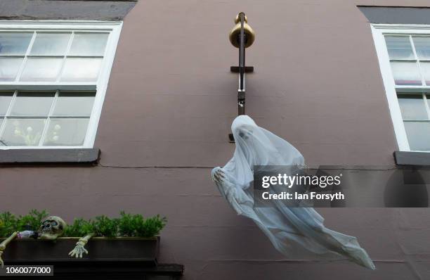 Ghostly shop decoration hangs above the shop doorway during Whitby Goth Weekend on October 27, 2018 in Whitby, England. The Whitby Goth weekend began...