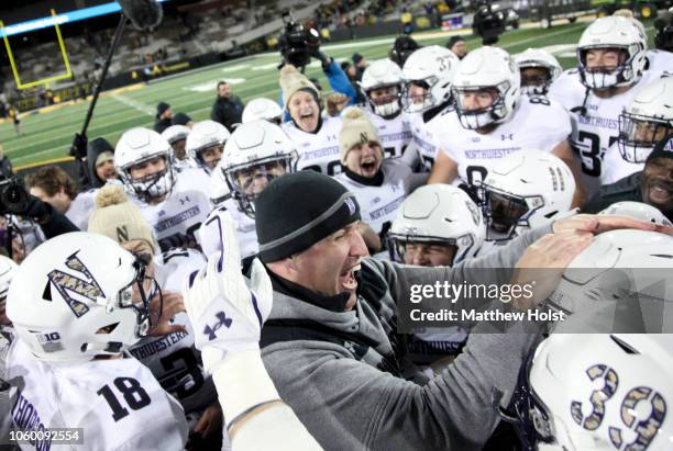 Head coach Pat Fitzgerald of the Northwestern Wildcats celebrates with his team after their defeat of the Iowa Hawkeyes, on November 10, 2018 at...