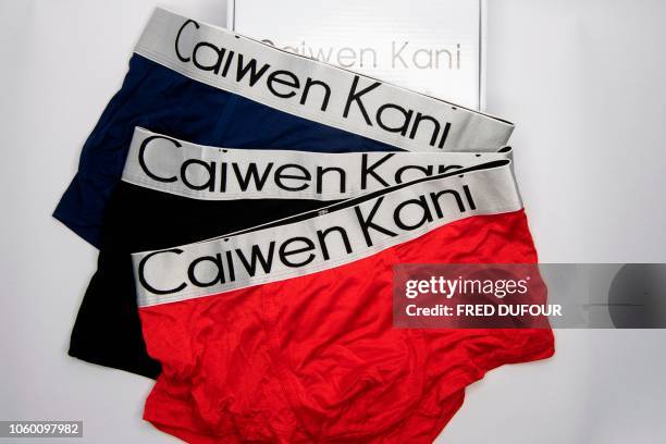 This photo illustration taken on November 6, 2018 shows of counterfeit underwear in Beijing. - As China held its massive annual "Singles Day" online...