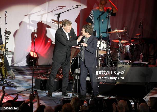 Steve Winwood and Michael J. Fox speak on stage at A Funny Thing Happened On The Way To Cure Parkinson's benefitting The Michael J. Fox Foundation at...