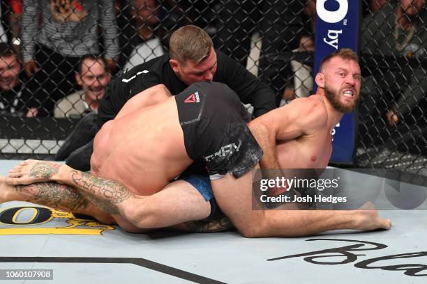 Donald Cerrone submits Mike Perry by arm bar in their welterweight bout during the UFC Fight Night event inside Pepsi Center on November 10, 2018 in...