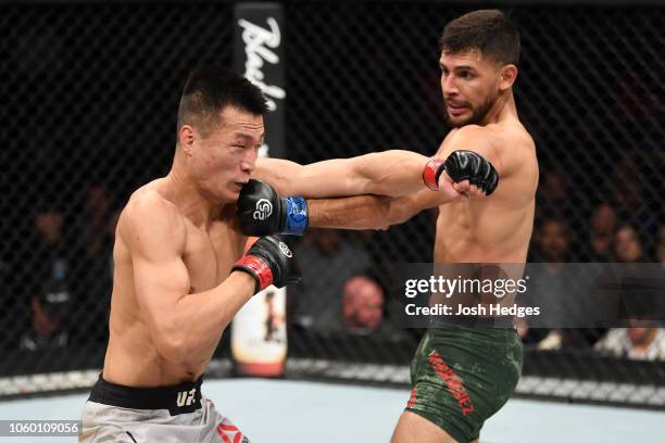 Yair Rodriguez of Mexico punches Chan Sung Jung of South Korea in their featherweight bout during the UFC Fight Night event inside Pepsi Center on...