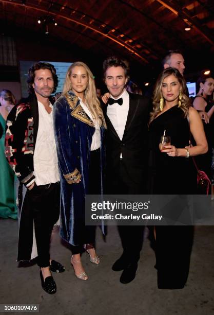 Greg Lauren, Elizabeth Berkley, Shawn Levy, and Serena Levy pose at the 2018 Baby2Baby Gala Presented by Paul Mitchell at 3LABS on November 10, 2018...
