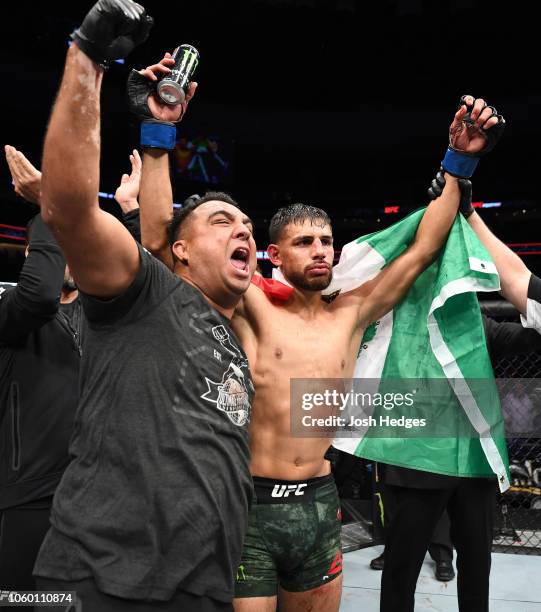 Yair Rodriguez of Mexico celebrates with his corner after defeating Chan Sung Jung of South Korea by knock out in the fifth round in their...