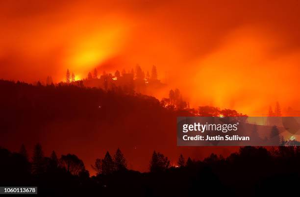 The Camp Fire burns in the hills on November 10, 2018 near Oroville, California. Fueled by high winds and low humidity the Camp Fire ripped through...