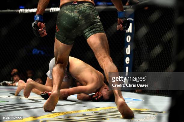 Chan Sung Jung of South Korea falls to the Octagon after being knocked out by Yair Rodriguez of Mexico in their featherweight bout during the UFC...