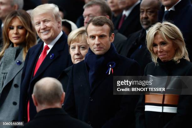 First Lady Melania Trump, US President Donald Trump, German Chancellor Angela Merkel, French President Emmanuel Macron and French President's wife...