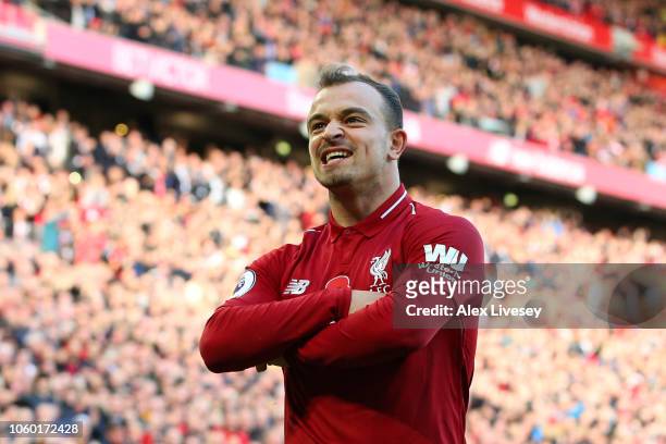 Xherdan Shaqiri of Liverpool celebrates after scoring his team's second goal during the Premier League match between Liverpool FC and Fulham FC at...