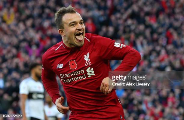 Xherdan Shaqiri of Liverpool celebrates after scoring his team's second goal during the Premier League match between Liverpool FC and Fulham FC at...