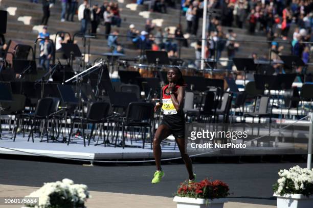 Shelmith Muriuki Nyawira enters the Panathenaic stadium and wins the women race at the 36th Athens Classic Marathon in Athens, Greece, November 11,...