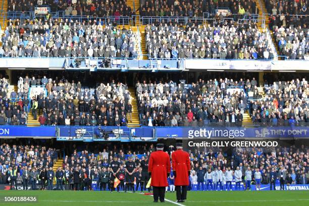 Two Chelsea pensioners and match officials observe a minute's silence to honour Remembrance Day ahead of the English Premier League football match...