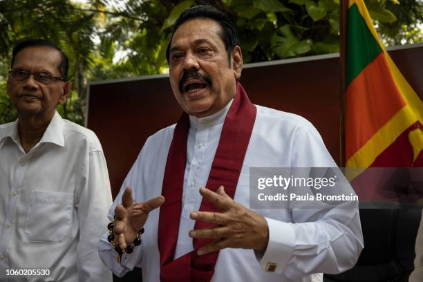 Acting Prime Minister Mahinda Rajapaksa speaks to members of his party and the media as he formally joins the Sri Lanka Freedom party as the...