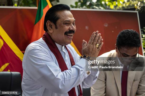 Acting Prime Minister Mahinda Rajapaksa speaks to members of his party and the media as he formally joins the Sri Lanka Freedom party as the...