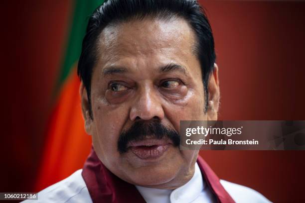 Acting Prime Minister Mahinda Rajapaksa speaks to members of his party and the media as he formally joins the Sri Lanka Freedom party as the...