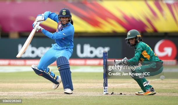 Smriti Mandhana of India bats with Sidra Nawaz, wicket keeper of Pakistan looking on during the ICC Women's World T20 2018 match between India and...