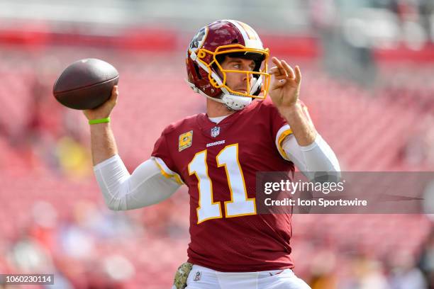 Washington Redskins quarterback Alex Smith warms up prior to the first half of an NFL game between the Washington Redskins and the Tampa Bay Bucs on...