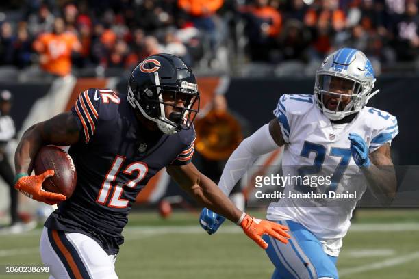 Allen Robinson of the Chicago Bears carries the football against Glover Quin of the Detroit Lions in the first quarter at Soldier Field on November...