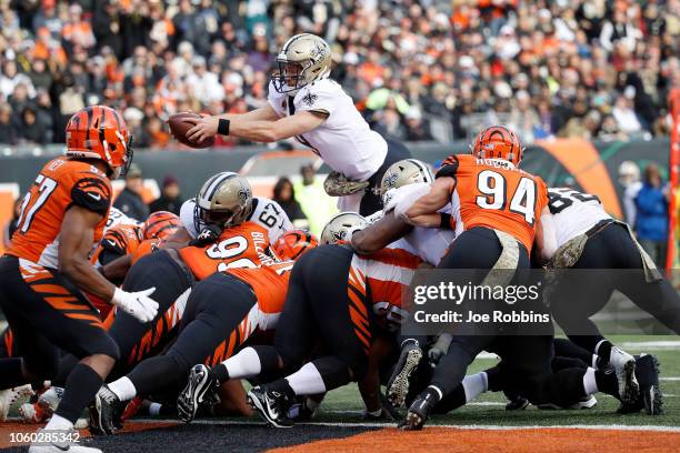 Drew Brees of the New Orleans Saints dives for a touchdown during the third quarter of the game against the Cincinnati Bengals at Paul Brown Stadium...