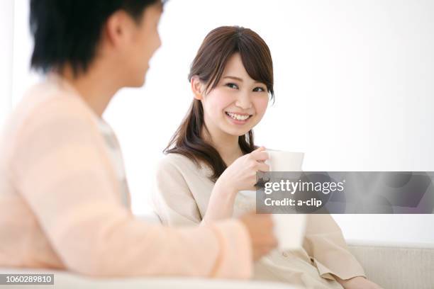 couple during tea time - asian couple having hi tea stockfoto's en -beelden