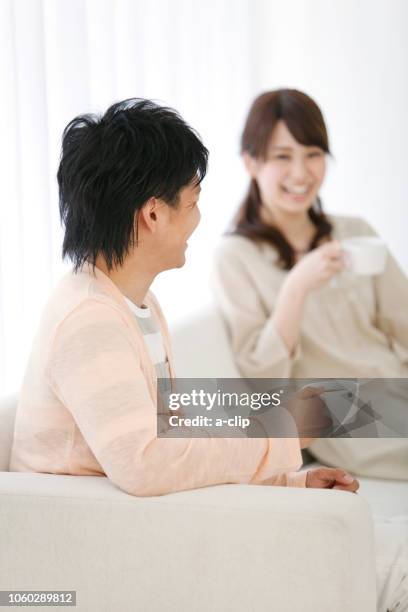 couple during tea time - asian couple having hi tea stock-fotos und bilder