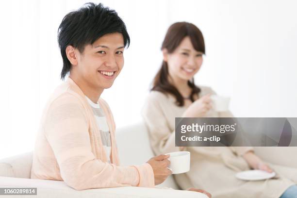 couple during tea time - asian couple having hi tea stock-fotos und bilder