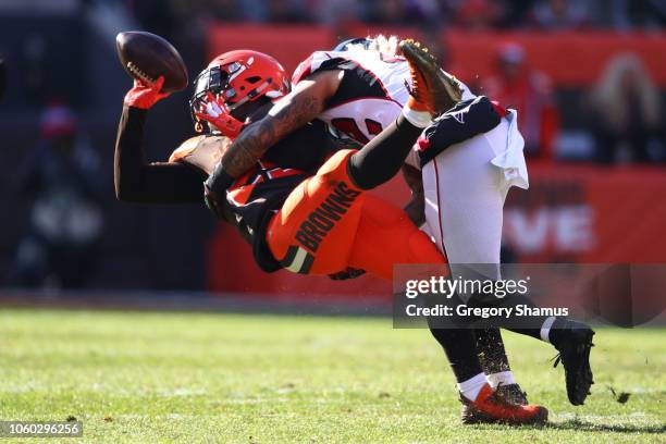 Nick Chubb of the Cleveland Browns is tackled by Duke Riley of the Atlanta Falcons in the first half at FirstEnergy Stadium on November 11, 2018 in...