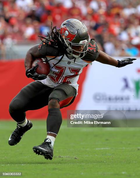 Jacquizz Rodgers of the Tampa Bay Buccaneers rushes during a game against the Washington Redskins at Raymond James Stadium on November 11, 2018 in...