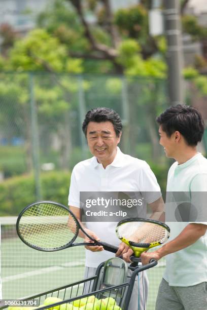 two men who play tennis - japanese tennis photos et images de collection